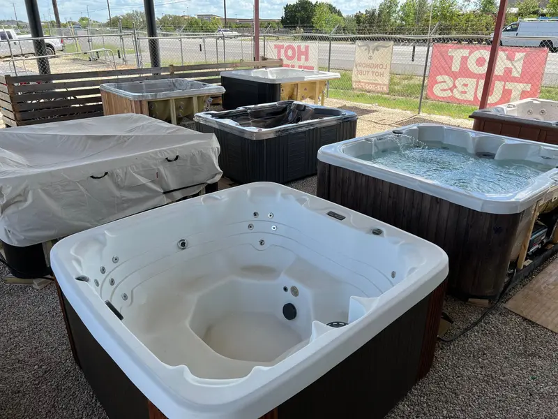 Hot tubs lined up under the shade on the Longhorn lot, 5990 Williams Drive